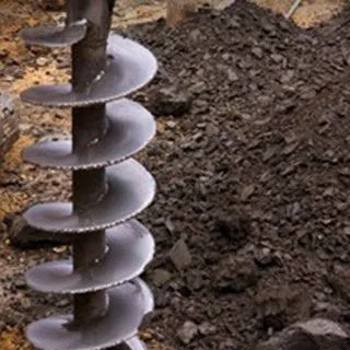 Manual drilling, PVC casing and pumping tests